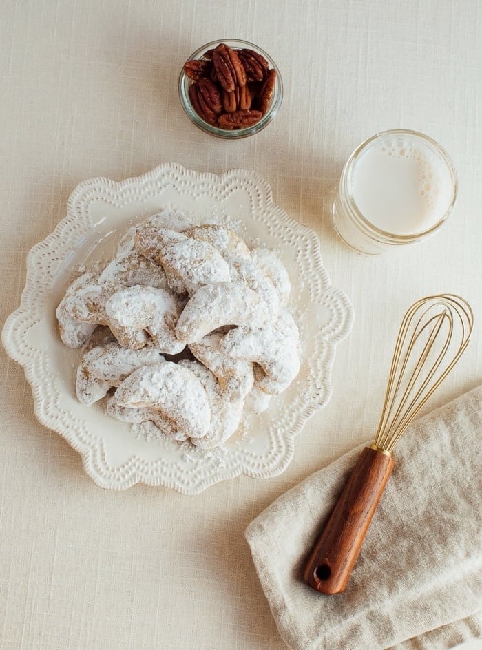 These simple almond flour crescent cookies are a healthy take on my nanny’s signature crescent cookie recipe. Each cookie only has about 60 calories and 2 grams of sugar plus they’re gluten-free and easily made vegan! 