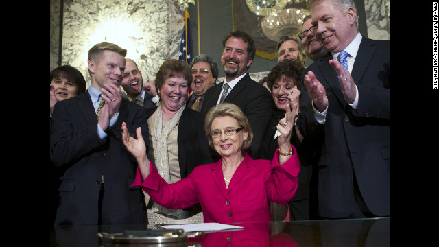 Washington Gov. Chris Gregoire celebrates after signing marriage equality legislation into law on February 13, 2012. Voters there approved same-sex marriage in November 2012.