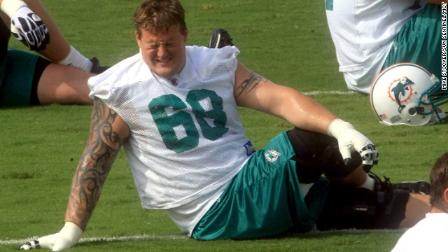 Incognito stretches during the last day of Dolphins minicamp in June 2010. 