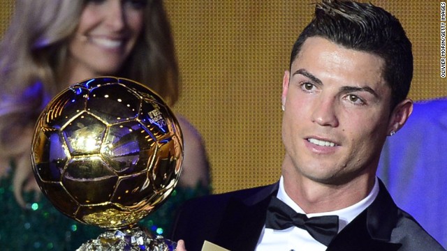 Cristiano Ronaldo raises the Ballon d'Or, after being crowned FIFA's best for the second time in his career. 