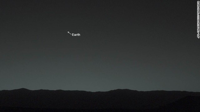This view of the twilight sky and Martian horizon, taken by NASA's Mars rover Curiosity, includes Earth as the brightest point of light in the night sky. Earth is a little left of center in the image, and our moon is just below Earth. A human observer with normal vision, if standing on Mars, could easily see Earth and the moon as two distinct, bright "evening stars."