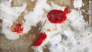 Blood is frozen in snow in Chicago\'s Logan Square neighborhood after a 68-year-old man was shot to death.
