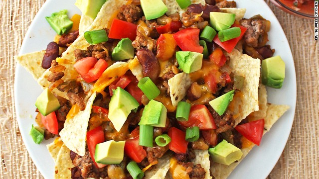 Instead of saturating your tortilla chips with copious amounts of the beloved dairy product, choose alternate toppings for a leaner, more flavorful approach on these healthy loaded nachos.