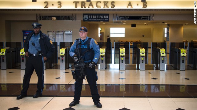 New Jersey Transit Police stand watch over a news briefing on December 9 concerning transportation to the Super Bowl at a station in Secaucus, New Jersey.