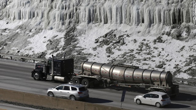 Traffic moves past an ice-covered hill on Interstate 75 in Covington, Kentucky, on January 29.
