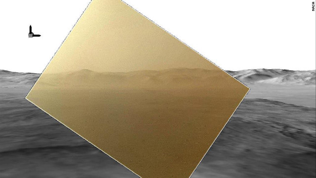 The color image captured by NASA's Mars rover Curiosity on August 7, 2012, has been rendered about 10% transparent so that scientists can see how it matches the simulated terrain in the background.