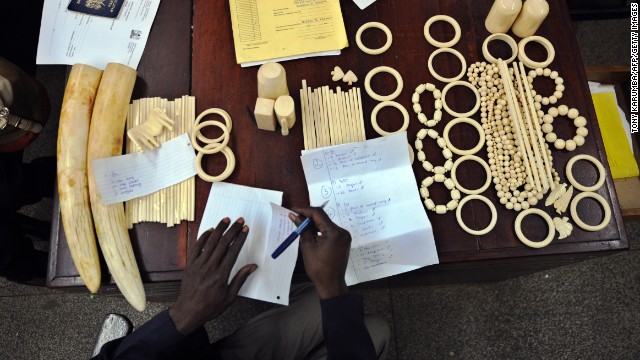 A police officer catalogs illegal ivory found in the possession of four Chinese men in Nairobi, Kenya, in January, 2013. The men pleaded guilty to smuggling thousands of dollars worth of ivory and were fined just $340 each. The loot included 40 chopsticks, six necklaces, bracelets and a pen holder, as well as raw ivory that had a black market value of $24,000 in Asia. 