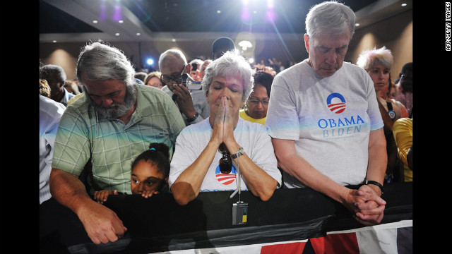 Obama supporters observe a moment of silence for the victims at a campaign event at Harborside Event Center in Fort Myers, Florida, on Friday. 