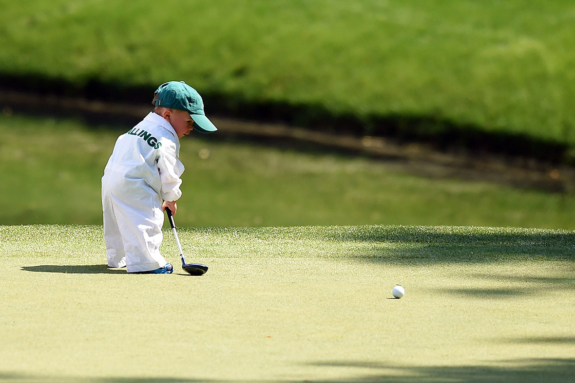 American golfer Scott Stallings's son Finn plays during the Par 3 Contest prior the start of the 78th Masters Golf Tournament at Augusta