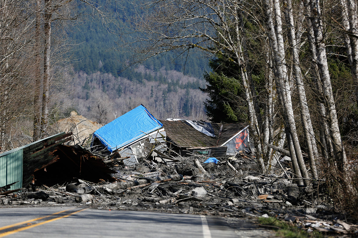 Buildings and landslide debris blocks Highway 530 near Oso, Washington