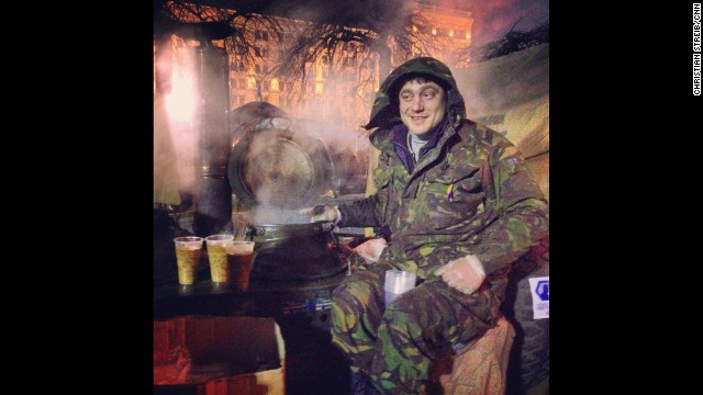 KIEV, UKRAINE: "27-year old Bogdan sits on top of his Russian-made soup kitchen in Indepence -- or Maidan -- Square on March 2. He's been sitting there for the last three months serving delicious Ukrainian grechaniy soup. It's made of buckwheat, lentil, coriander and beef. Amazing taste." - CNN's Christian Streib. Follow Christian on Instagram at http://ift.tt/1oUPDqV.