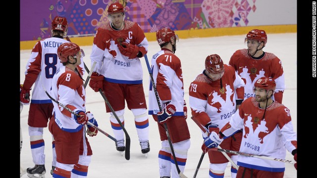 The men's hockey team from Russia looks dejected after losing to Finland on February 19.