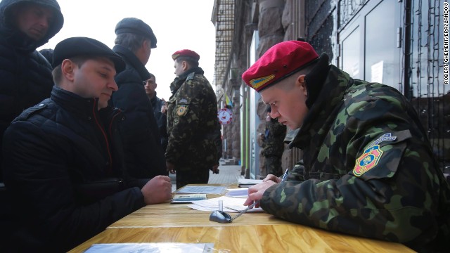A Ukrainian man applies for the National Guard at a mobile recruitment center in Kiev on March 17.
