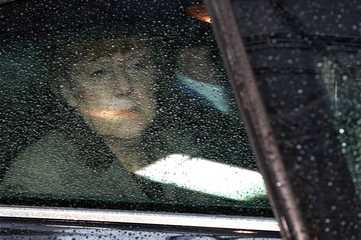 Germany's Chancellor Angela Merkel looks through her car window as she arrives at a European Union leaders summit in Brussels