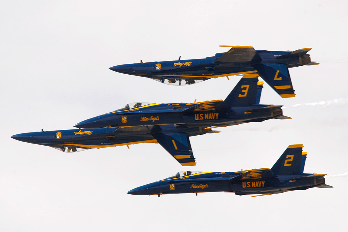 The US Navy Flight Demonstration Squadron, the Blue Angels, fly in a tight formation as they rehearse for the Los Angeles County Air Show