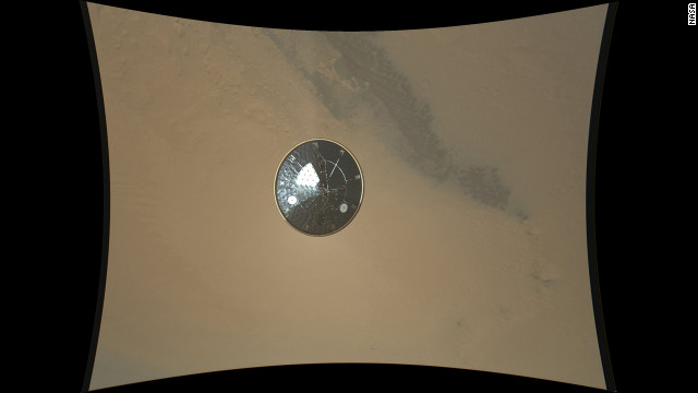 This color full-resolution image showing the heat shield of NASA's Curiosity rover was obtained during descent to the surface of Mars on August 13, 2012. The image was obtained by the Mars Descent Imager instrument known as MARDI and shows the 15-foot diameter heat shield when it was about 50 feet from the spacecraft. 
