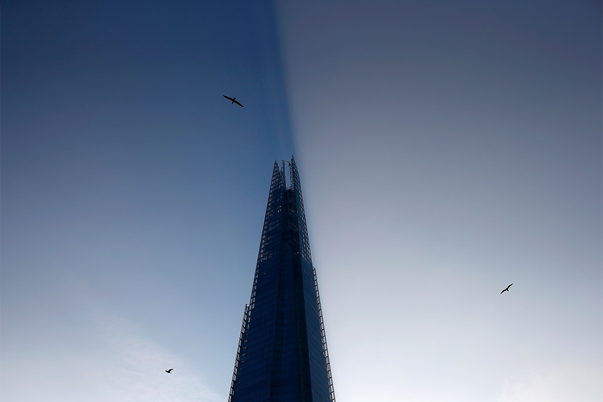 The Shard casts a shadow across the morning haze in London