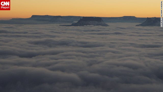From the Green River Overlook in Canyonlands National Park in Moab, Utah, the <a href='http://ift.tt/QETG0v' target='_blank'>Island in the Sky</a> mesa surrounded by clouds of fog looks almost majestic. "It felt heavenly to be there at that time," <a href='http://ift.tt/1mH3cLE'>Nishani Kadidal</a> said. 