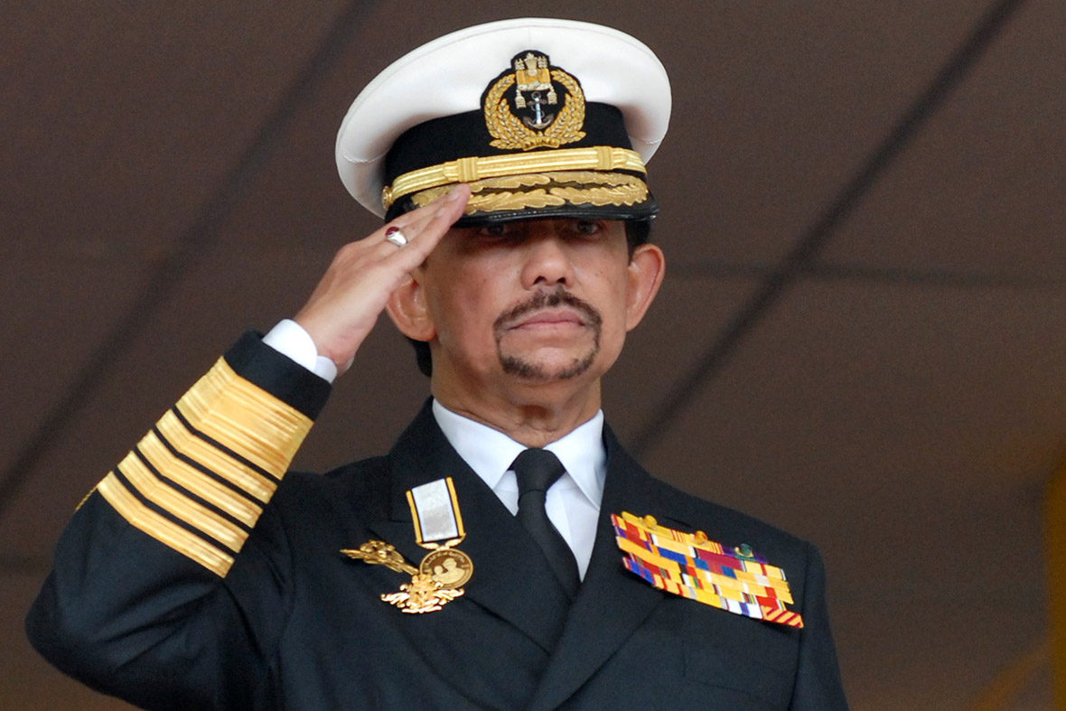 February 23, 2009: Brunei's Sultan Hassanal Bolkiah salutes the guard of honour during the country's 25th National Day celebrations in Bandar Seri Begawan. He was made an Honorary Admiral of the Royal Navy by the Queen in 2001