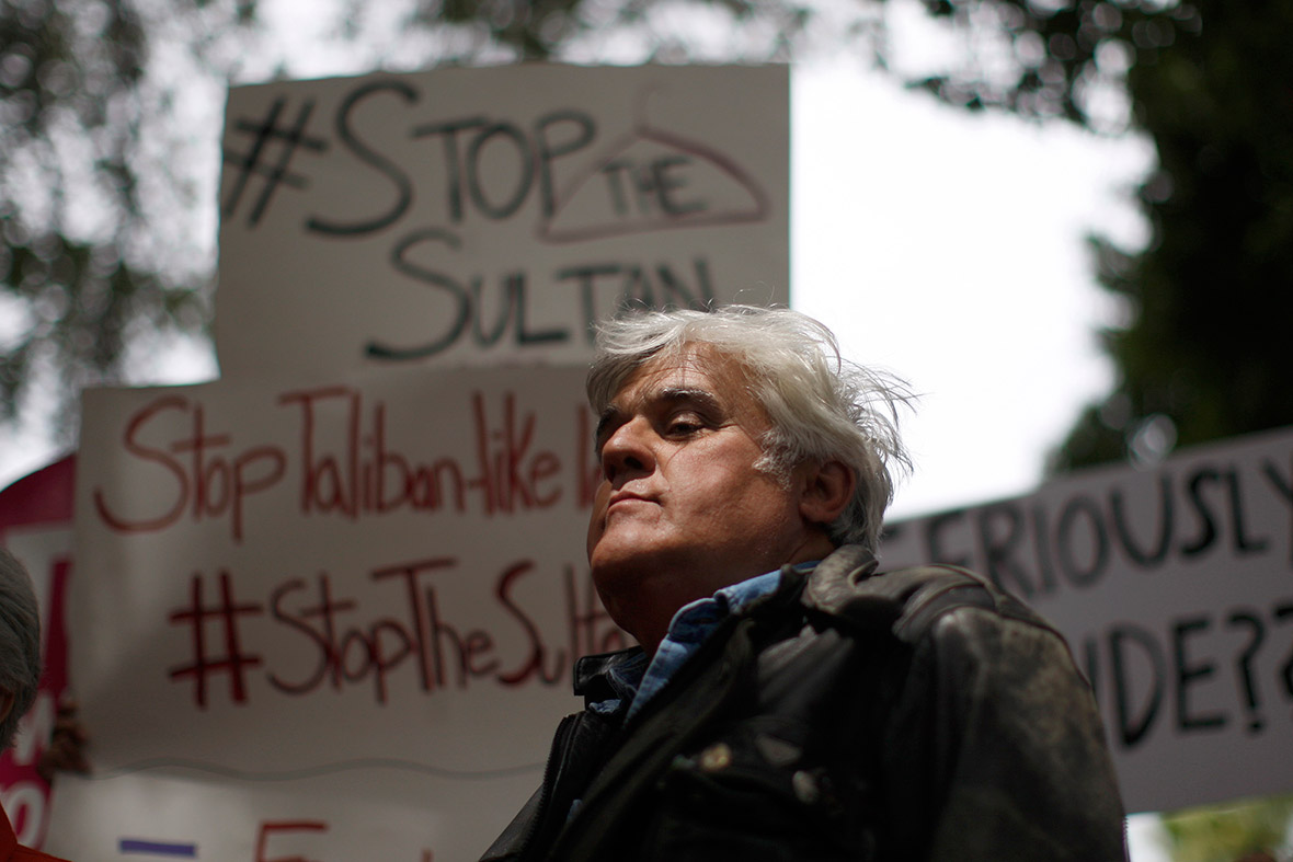 May 5, 2014: Jay Leno protests outside the Beverly Hills Hotel, which is owned by the Sultan of Brunei, against the draconian punishment of women and gay people announced by the Sultan. Brunei is implementing a brand of Sharia Penal Code which calls for the stoning of people for offences including homosexual acts, adultery, sodomy and extramarital sexual relations