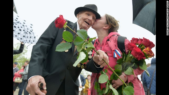 A woman kisses a World War II veteran in Riga, Latvia, on Friday, May 9, as the country's large Russian minority gathered to celebrate Victory Day, the anniversary of Nazi Germany's surrender to the Soviet Union.