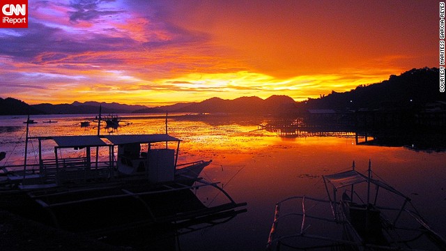 A sunset illuminates the sky with radiant colors in Coron, Palawan. "In the Philippines, you need not splurge to see its beauty," <a href='http://ift.tt/1hGmvQh'>Maritess Garcia-Reyes</a> said. 
