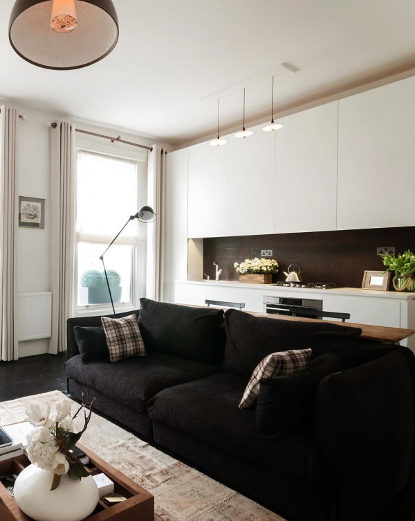 Our first small apartment design is a London pad, measuring 521 square feet, or 48 square meters. Two large windows help out here by filling the compact space with natural light, but the décor scheme helps things along with an airy, bright palette.