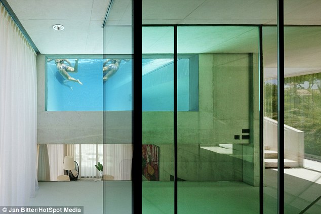 Stunning design: The pool on top of a £9m Marbella holiday villa has glass sides and floor