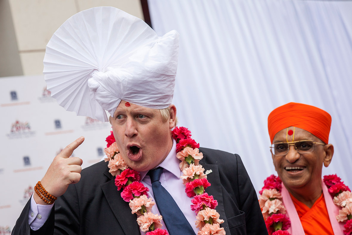 The Mayor of London Boris Johnson wears a traditional headdress during a visit to the Shree Swaminarayan Mandir, a major new Hindu temple being built in Kingsbury, London