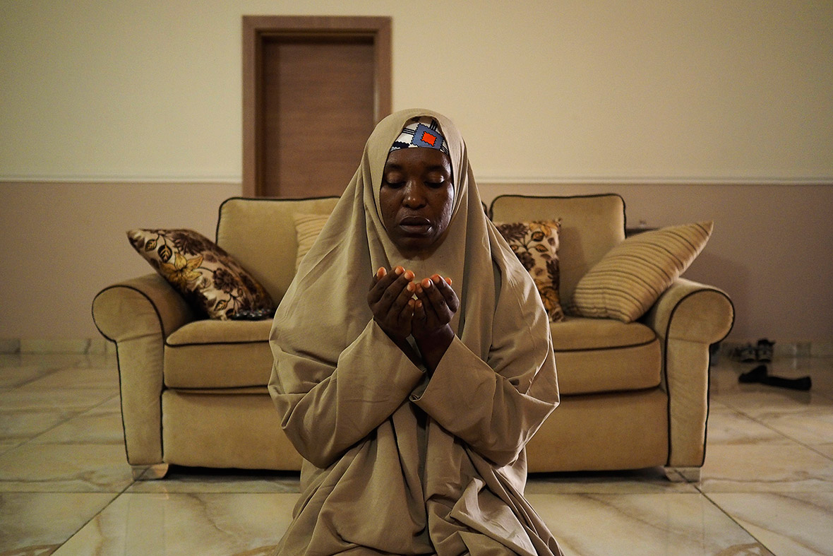 Aisha Yesufu, 40, prays in her home in Abuja. Yesufu, a businesswoman who is originally from Kano and has two children, has joined protests calling for the release of school girls abducted from the remote village of Chibok