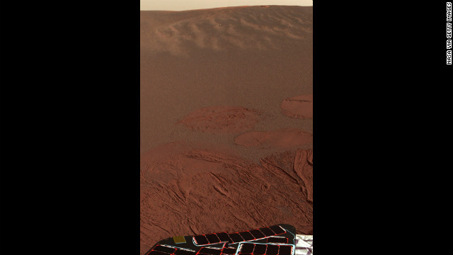 Pictured is the Martian landscape at Meridiani Planum, where the Mars Exploration Rover Opportunity successfully landed in 2004. This is one of the first images beamed back to Earth from the rover shortly after it touched down.