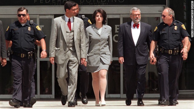 Lewinsky is escorted by police officers, federal investigators and attorney William Ginsburg, second right, as she leaves the Federal Building in Westwood, California, in 1998. She was there submitting evidence on her relationship with Clinton, who was impeached by the House of Representatives on charges of perjury and obstruction of justice. He was later acquitted.