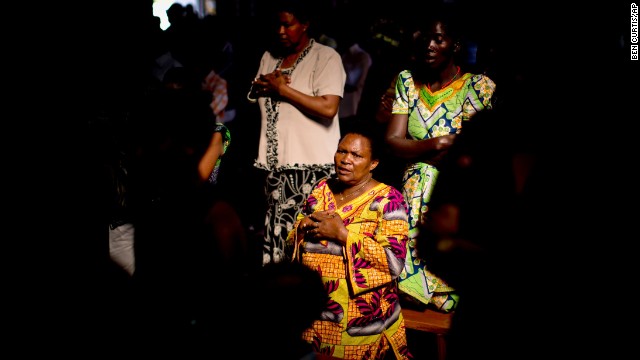 Members of the Sainte-Famille Catholic Church congregation pray during a Sunday morning service in Kigali on April 6. The church was the scene of many killings during the 1994 genocide.