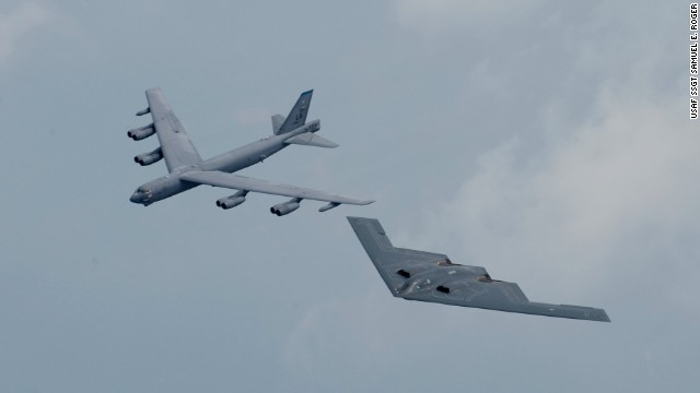 A B-52, left, and a B-2 stealth bomber fly in formation over Shreveport, Louisiana. The United States deployed both types of aircraft to Britain in June.