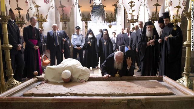 Francis and Ecumenical Patriarch of Constantinople Bartholomew I pray over the Stone of Unction at the Church of the Holy Sepulchre in Jerusalem's Old City on Sunday, May 25. The Pope joined Bartholomew in a historic joint prayer for Christian unity at Christianity's holiest site in Jerusalem.