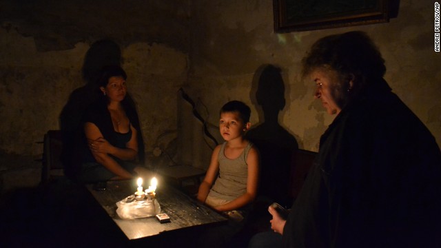 People take refuge in a bomb shelter during clashes between Ukrainian government troops and pro-Russia fighters in Slovyansk, Ukraine, on Sunday, June 22.