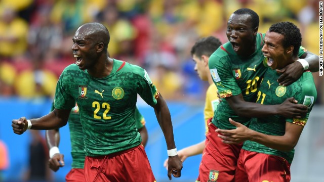 Cameroon midfielder Joel Matip, right, celebrates with Allan Nyom and Vincent Aboubakar after scoring a goal against Brazil.