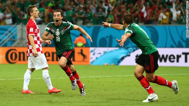 Andres Guardado of Mexico, center, celebrates after scoring the second goal against Croatia.