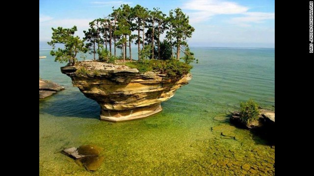 On a clear, sunny day at Lake Huron, the not romantically-named Turnip Rock in Michigan, will overcome its name.