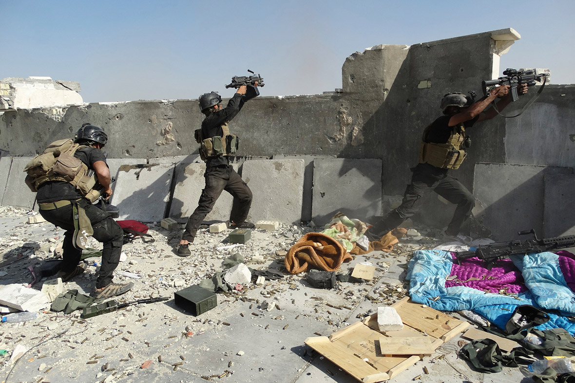 Members of the Iraqi Special Operations Forces engage in a firefight with the al-Qaeda-linked Islamic State of Iraq and the Levant (Isis) in Ramadi