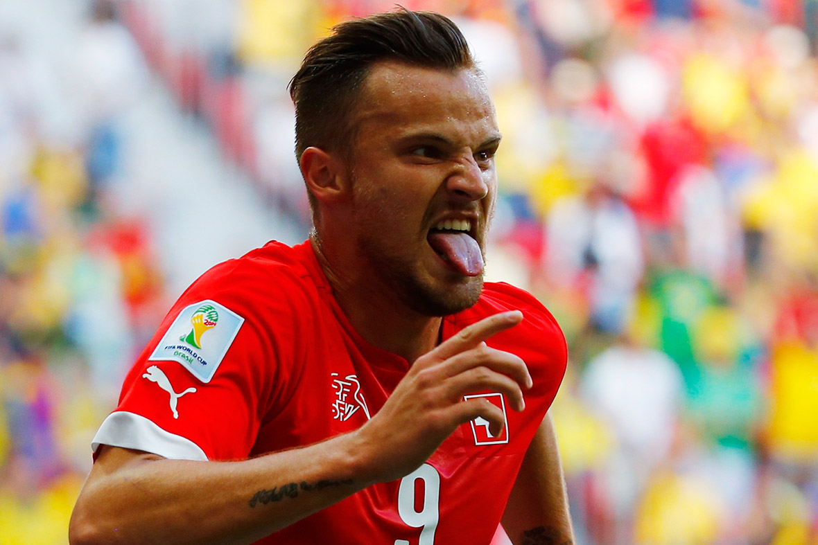 Switzerland's Haris Seferovic celebrates after scoring a goal to defeat Ecuador in their 2014 World Cup Group E match in Brasilia on June 15, 2014