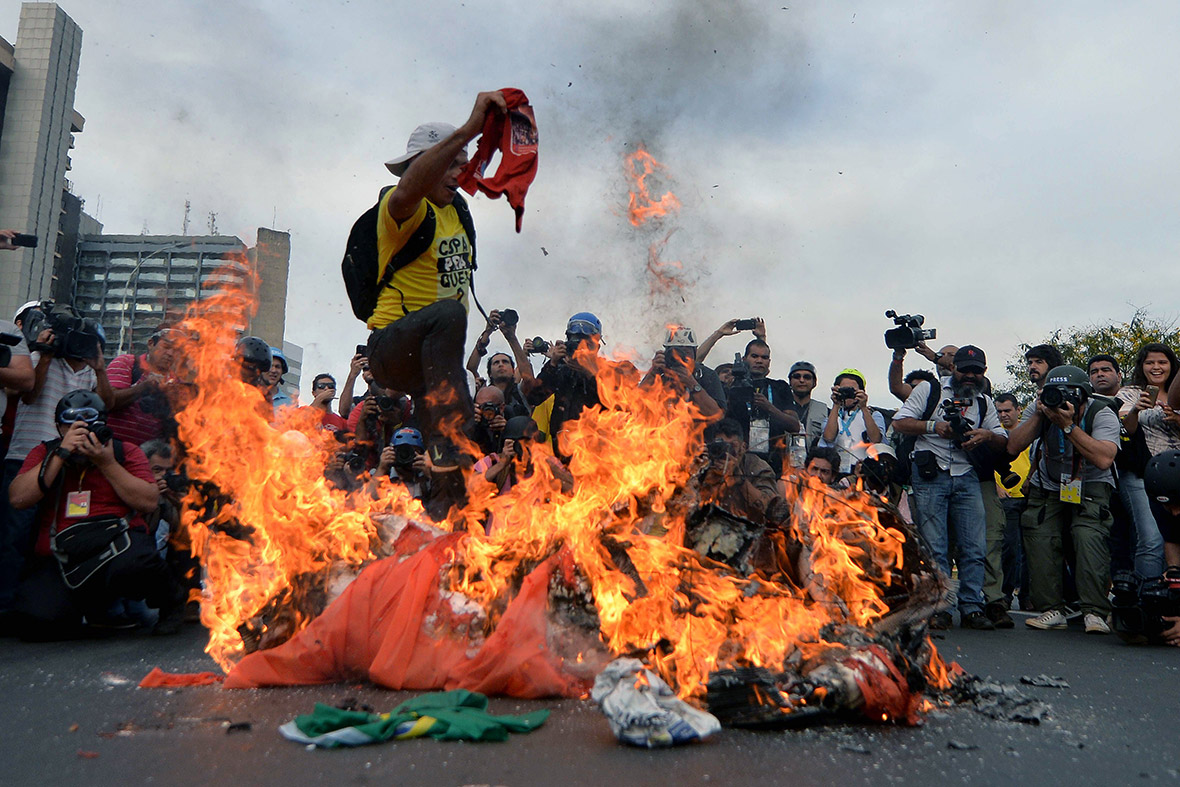 Demonstrators take part in an anti-World Cup protest near the Mane Garrincha stadium in Brasilia