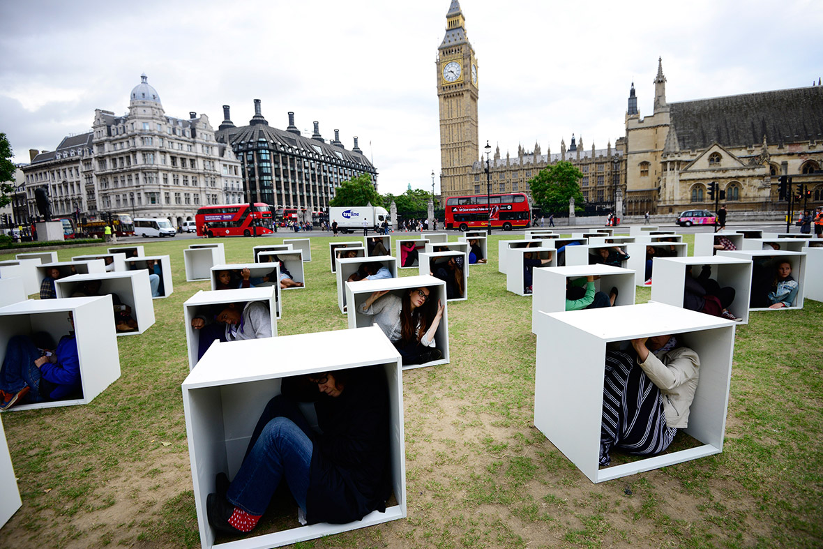 Volunteers sit in wooden boxes on Parliament Square in London, to represent living conditions in Gaza. Some 150 men, women and children crammed themselves into boxes in a bid to illustrate the conditions faced by the people of Gaza trapped by the blockade, in an event organised by Oxfam