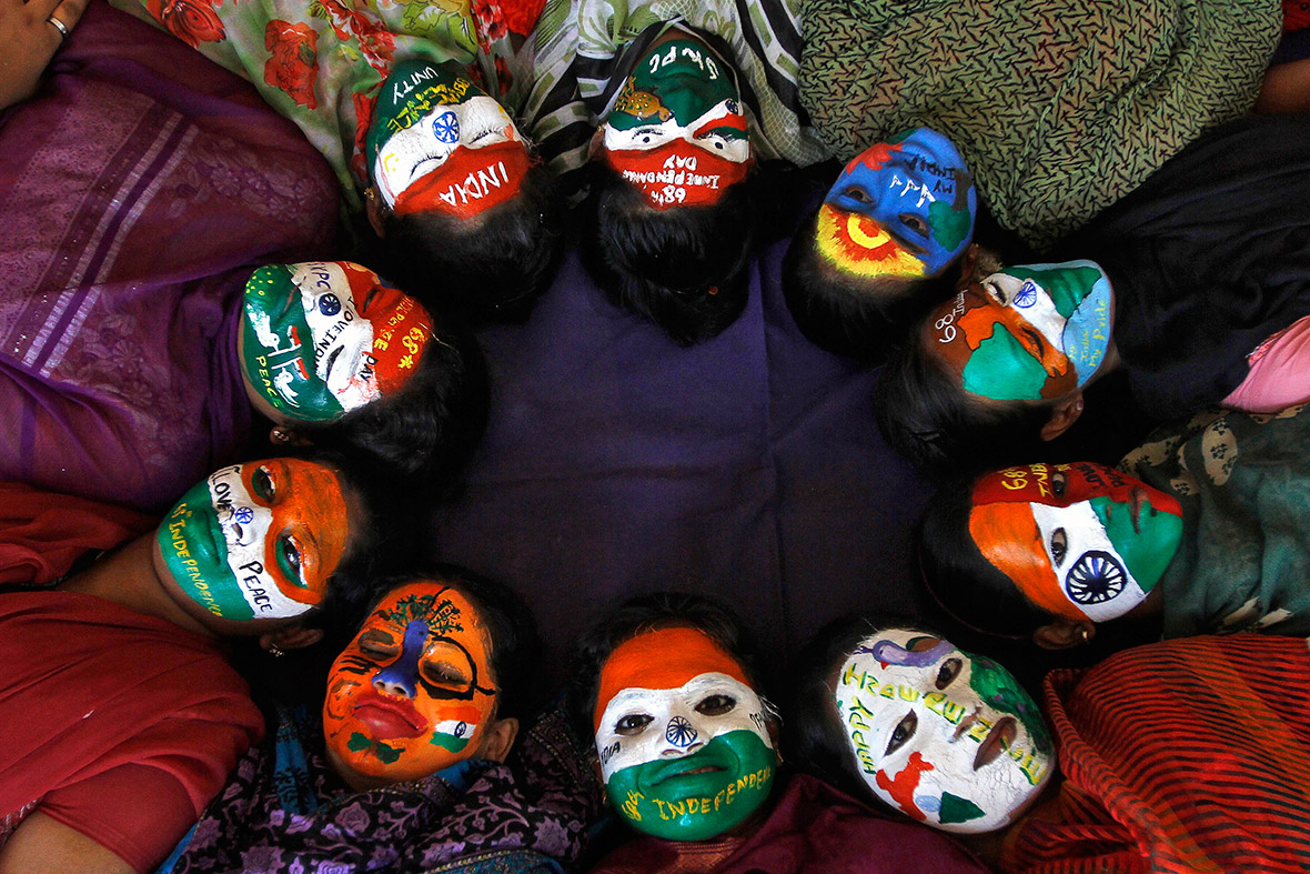 College students with painted faces pose for a picture in the southern Indian city of Chennai