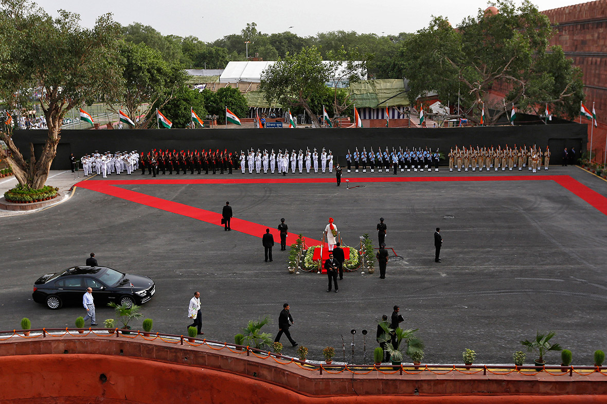 Indian Prime Minister Narendra Modi inspects a guard of honour upon his arrival at the historic Red Fort during Independence Day celebrations in Delhi