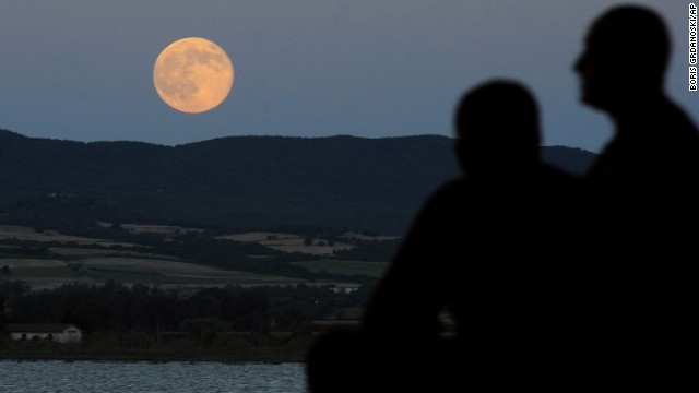 The moon is seen as it rises above Dojran Lake in southeastern Macedonia. NASA says that there will be three "supermoons" this year, occuring on July 12, August 10 and September 9.