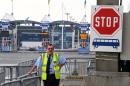 A member of the UK Border agency stands at the entrance of the Channel Ferries in Calais, northern France, on January 27, 2009