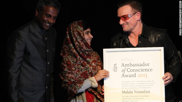 Musician Bono and Secretary General of Amnesty International Salil Shetty honor the teen with the Amnesty International Ambassador of Conscience Award for 2013 at the Manison House in Dublin, Ireland, on September 17. The award is Amnesty International's highest honor, recognizing individuals who have promoted and enhanced the cause of human rights.