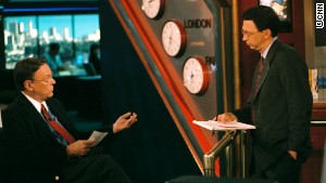 Bruce Morton, seated, talks with colleague Frank Senso in CNN\'s Atlanta newsroom in 2004.