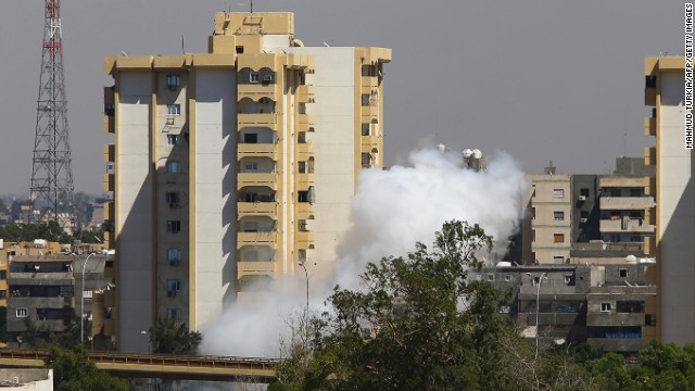 Smoke billows near Tripoli international airport as militias continued to battle for control on July 20, 2014.